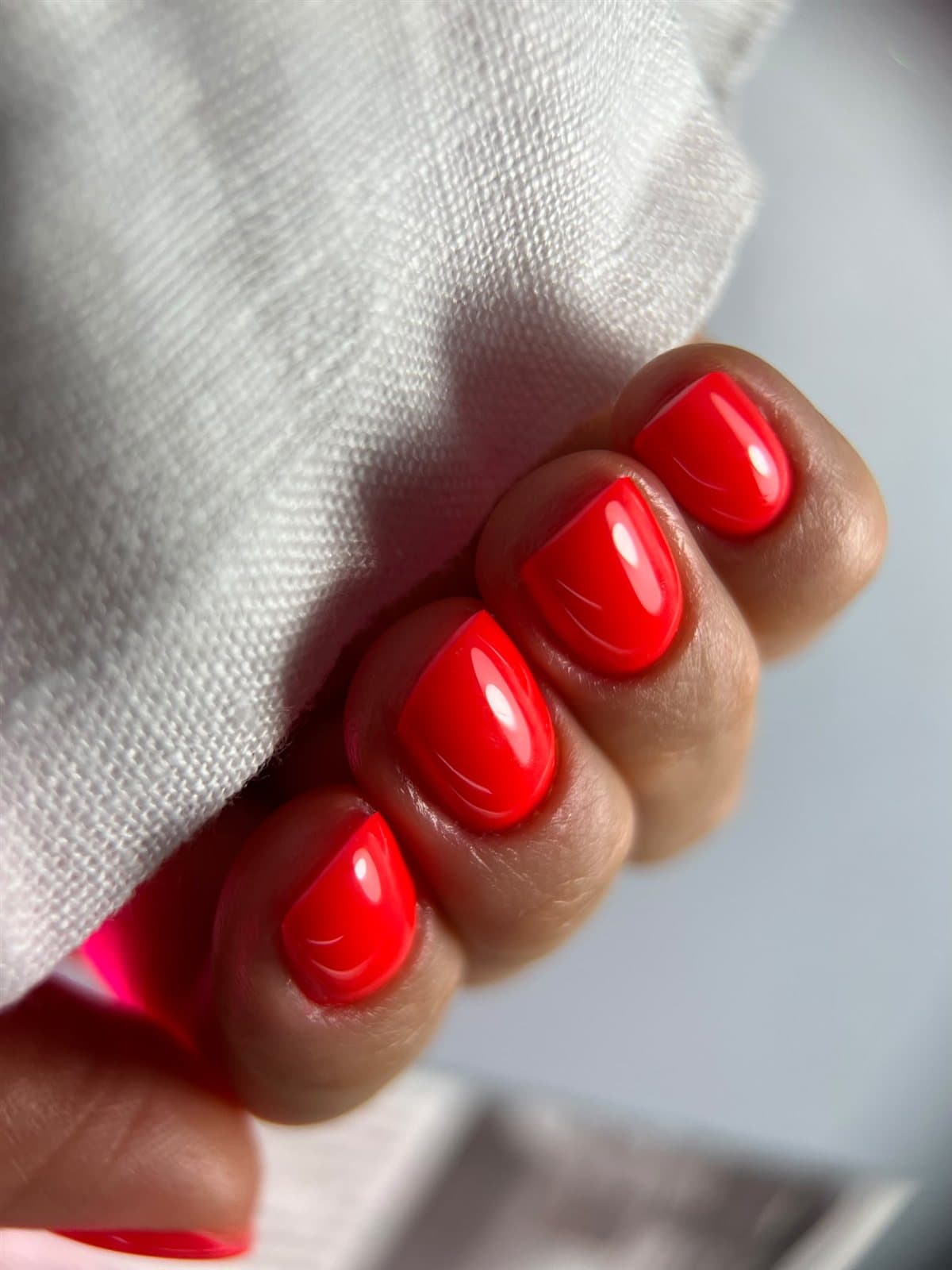 Glossy red almond nails