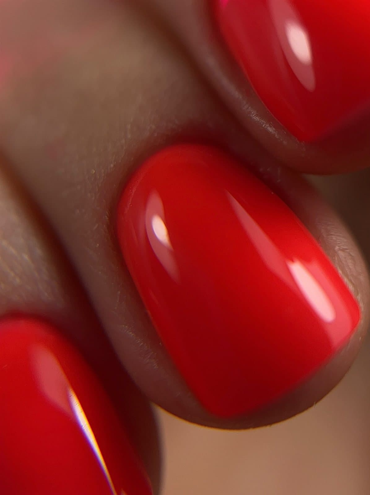 Close-up of glossy red nails