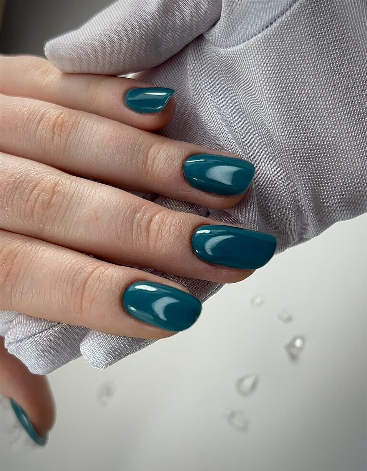 Deep teal glossy nails
